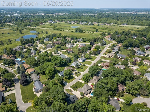 1484 Kings Pointe Rd, Grand Blanc, MI 48439 - aerial overview of property's location with a large body of water and nearby suburban area