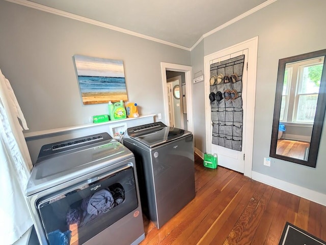 128 E Walnut St, Hastings, MI 49058 - laundry room featuring washer and clothes dryer, wood-type flooring, and ornamental molding