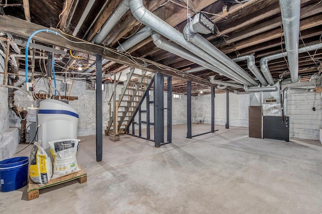 378 Goguac St W, Battle Creek, MI 49015 - unfinished basement featuring heating unit and stairs