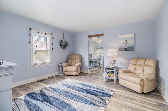 378 Goguac St W, Battle Creek, MI 49015 - sitting room featuring wood finished floors and arched walkways