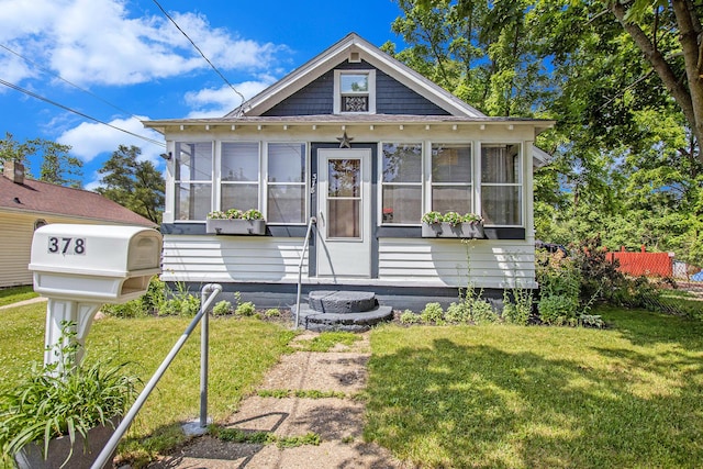 378 Goguac St W, Battle Creek, MI 49015 - view of front of property with a sunroom