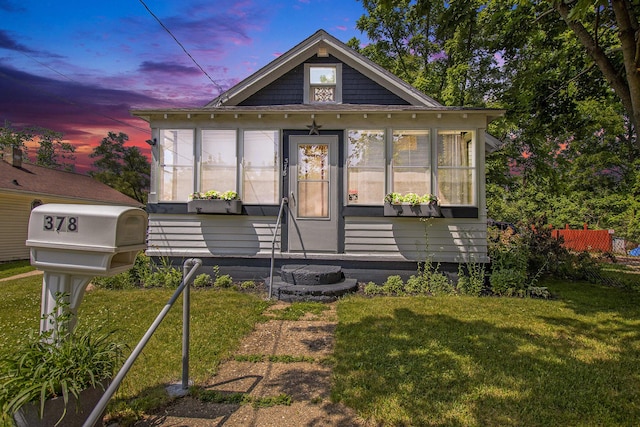 378 Goguac St W, Battle Creek, MI 49015 - bungalow-style home featuring a sunroom