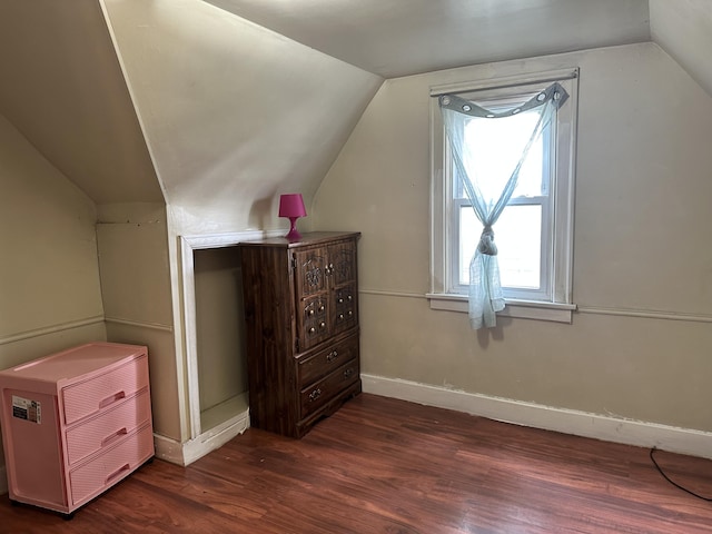 1478 Allen Ave, Muskegon, MI 49442 - additional living space with dark wood-style floors, vaulted ceiling, and plenty of natural light