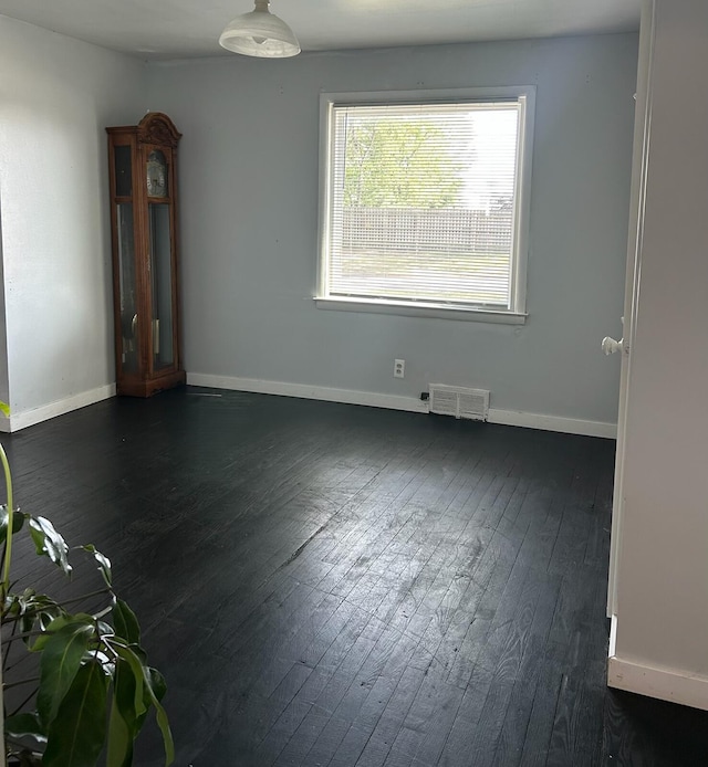 1478 Allen Ave, Muskegon, MI 49442 - spare room featuring dark wood finished floors and baseboards