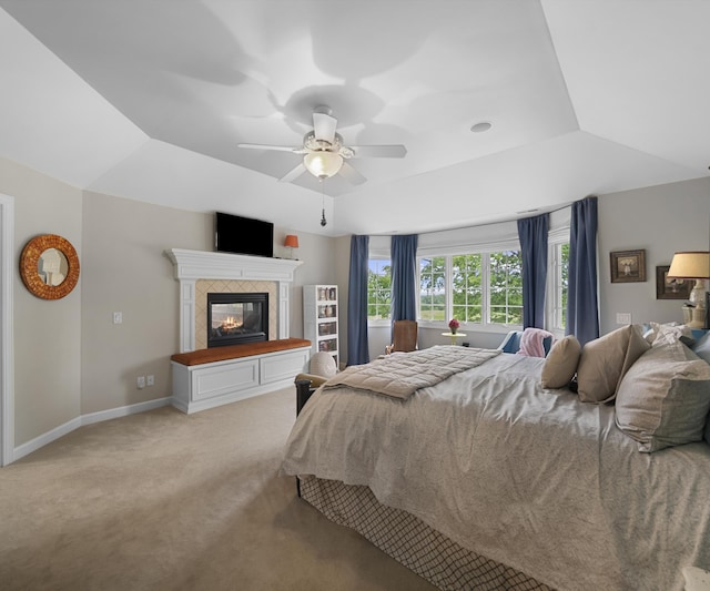 5011 Rockaway Ln, Clarkston, MI 48348 - bedroom featuring light colored carpet, a tiled fireplace, and a ceiling fan