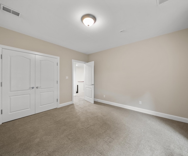 5011 Rockaway Ln, Clarkston, MI 48348 - unfurnished bedroom featuring carpet floors and a closet
