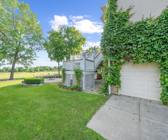 5011 Rockaway Ln, Clarkston, MI 48348 - view of grassy yard with concrete driveway and a garage