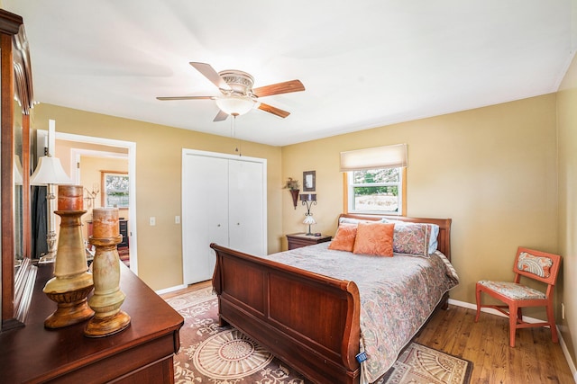 4515 S Lincoln Rd, Mount Pleasant, MI 48858 - bedroom featuring light wood-style flooring, a closet, and ceiling fan
