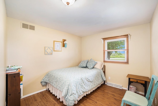4515 S Lincoln Rd, Mount Pleasant, MI 48858 - bedroom featuring baseboards and wood finished floors