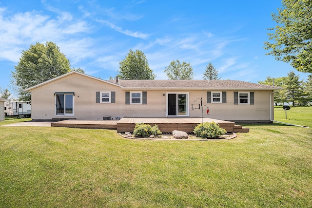4515 S Lincoln Rd, Mount Pleasant, MI 48858 - rear view of property featuring a yard and a wooden deck