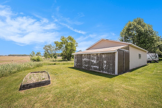 4515 S Lincoln Rd, Mount Pleasant, MI 48858 - view of green lawn with an outbuilding and a vegetable garden