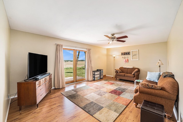 4515 S Lincoln Rd, Mount Pleasant, MI 48858 - living area featuring a ceiling fan and light wood-style flooring