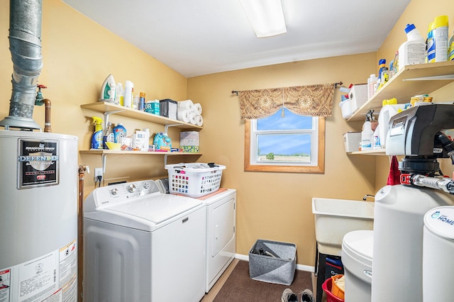 4515 S Lincoln Rd, Mount Pleasant, MI 48858 - washroom featuring water heater, washer and clothes dryer, and carpet flooring
