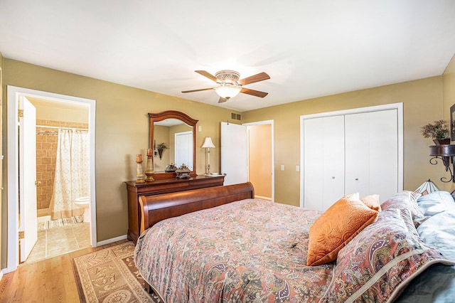 4515 S Lincoln Rd, Mount Pleasant, MI 48858 - bedroom featuring a closet, light wood-type flooring, a ceiling fan, and ensuite bath