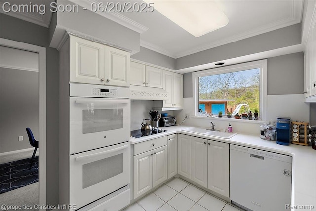4160 Dawn Ln, West Bloomfield, MI 48323 - kitchen with white appliances, light countertops, crown molding, white cabinets, and under cabinet range hood