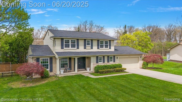4160 Dawn Ln, West Bloomfield, MI 48323 - traditional-style house with covered porch, driveway, an attached garage, roof with shingles, and brick siding