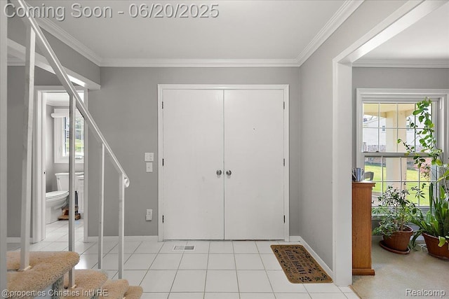 4160 Dawn Ln, West Bloomfield, MI 48323 - entryway featuring healthy amount of natural light, crown molding, light tile patterned floors, and stairway