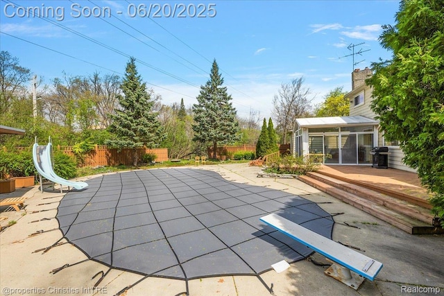 4160 Dawn Ln, West Bloomfield, MI 48323 - view of swimming pool with a fenced backyard, a patio area, and a sunroom