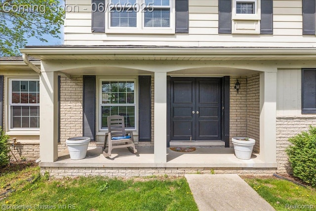 4160 Dawn Ln, West Bloomfield, MI 48323 - view of exterior entry featuring covered porch and brick siding