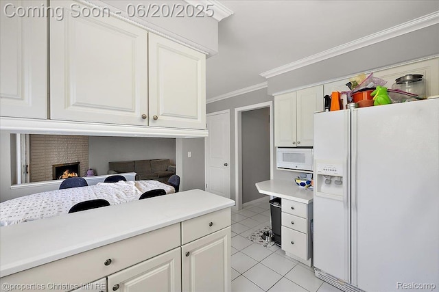 4160 Dawn Ln, West Bloomfield, MI 48323 - kitchen with white appliances, light tile patterned flooring, crown molding, light countertops, and white cabinets