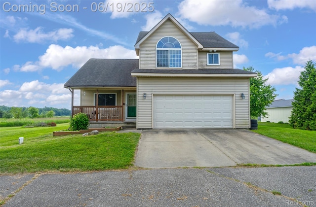 2102 Oakwood Rd, Ortonville, MI 48462 - traditional-style house with a front lawn, a porch, an attached garage, and concrete driveway