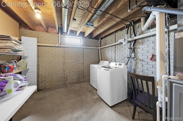 2102 Oakwood Rd, Ortonville, MI 48462 - basement featuring independent washer and dryer and brick wall