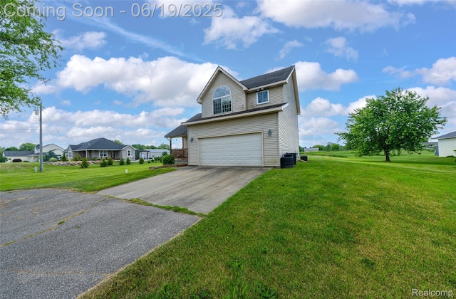 2102 Oakwood Rd, Ortonville, MI 48462 - view of front of property with an attached garage, a front yard, concrete driveway, and a residential view