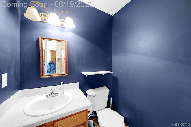 2102 Oakwood Rd, Ortonville, MI 48462 - bathroom with vanity and a chandelier