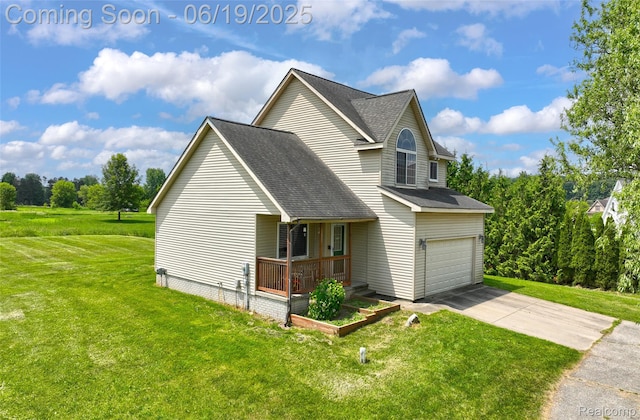 2102 Oakwood Rd, Ortonville, MI 48462 - view of front of property with concrete driveway, a front lawn, roof with shingles, covered porch, and an attached garage