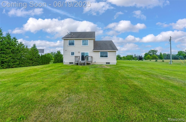 2102 Oakwood Rd, Ortonville, MI 48462 - rear view of house with a lawn