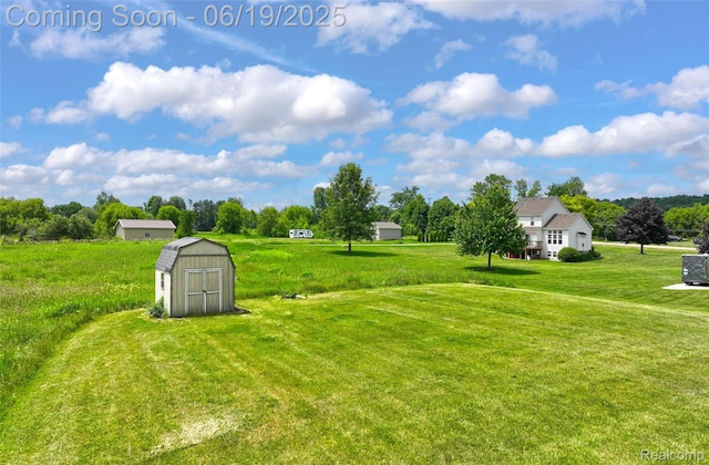 2102 Oakwood Rd, Ortonville, MI 48462 - view of grassy yard featuring a storage shed