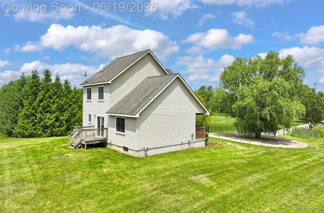 2102 Oakwood Rd, Ortonville, MI 48462 - view of side of property with roof with shingles, a yard, and a wooden deck