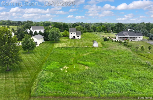 2102 Oakwood Rd, Ortonville, MI 48462 - aerial view of sparsely populated area with a tree filled landscape