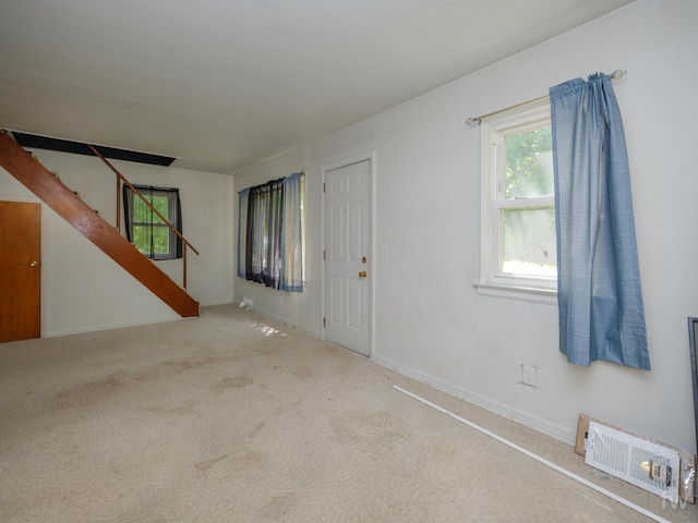 223 Ruth St, Portage, MI 49002 - spare room featuring stairs and carpet flooring