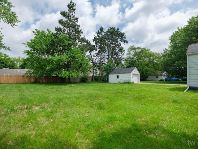 223 Ruth St, Portage, MI 49002 - view of yard featuring an outbuilding and a detached garage