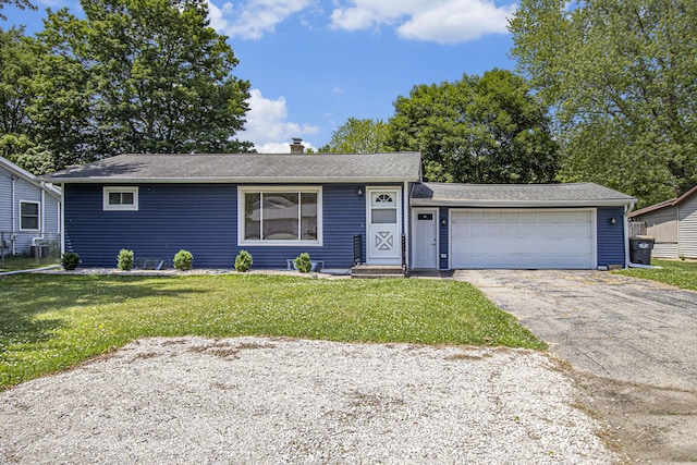 8814 S Sprinkle Rd, Portage, MI 49002 - single story home with a chimney, driveway, a front lawn, and a garage