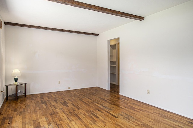 8814 S Sprinkle Rd, Portage, MI 49002 - unfurnished room with wood finished floors and beamed ceiling