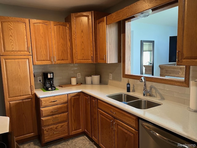 7369 Sheridan Rd, Flushing, MI 48433 - kitchen featuring dishwasher, backsplash, and brown cabinetry