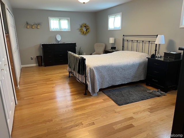 7369 Sheridan Rd, Flushing, MI 48433 - bedroom with light wood-style flooring and baseboards