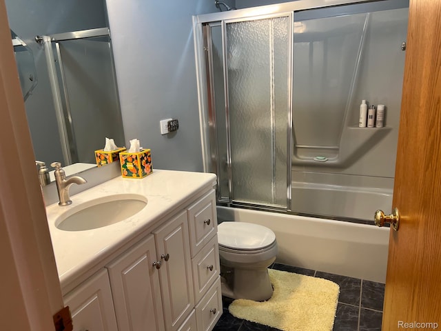 7369 Sheridan Rd, Flushing, MI 48433 - full bathroom featuring vanity, shower / bath combination with glass door, and tile patterned flooring