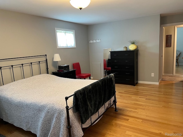 7369 Sheridan Rd, Flushing, MI 48433 - bedroom with light wood-type flooring and baseboards