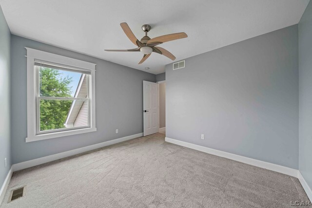7555 Sherlock Dr, Onsted, MI 49265 - spare room featuring carpet floors and a ceiling fan