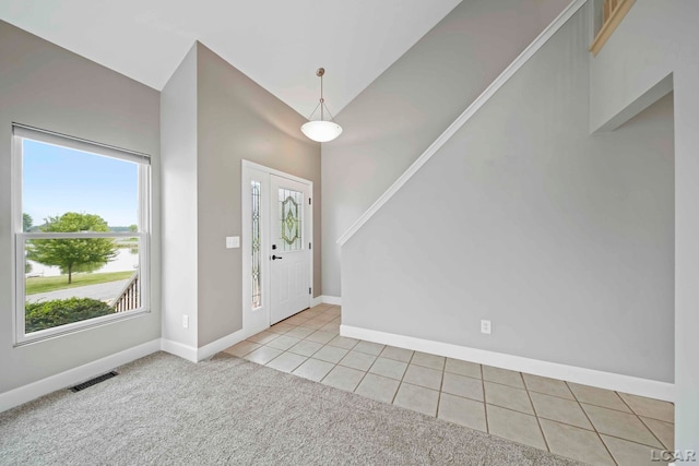 7555 Sherlock Dr, Onsted, MI 49265 - carpeted foyer with baseboards and tile patterned flooring