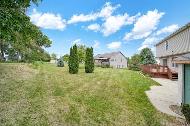 7555 Sherlock Dr, Onsted, MI 49265 - view of grassy yard featuring a wooden deck