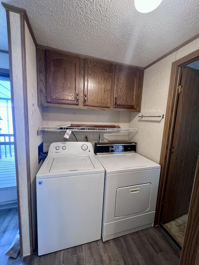 2701 Huizenga St Trlr # 4, Norton Shores, MI 49444 - laundry room with a textured ceiling, cabinet space, dark wood-style flooring, and separate washer and dryer