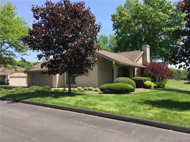 1829 Golf Ridge Dr, Bloomfield Hills, MI 48302 - view of front of house with a chimney, a front lawn, and an attached garage