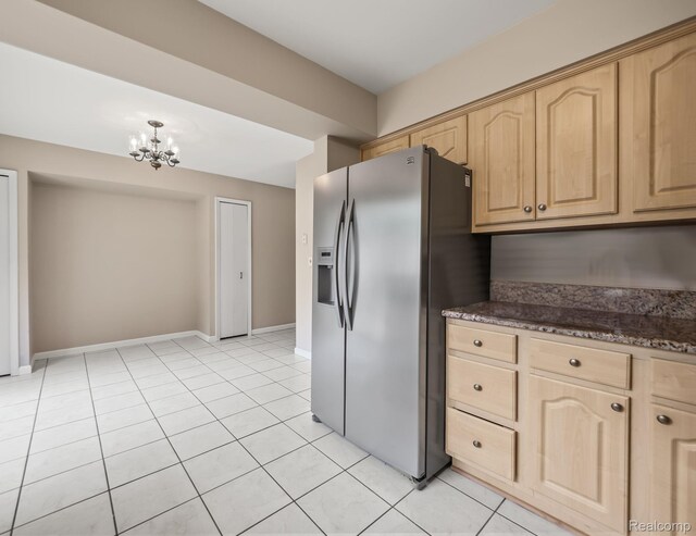 1829 Golf Ridge Dr, Bloomfield Hills, MI 48302 - kitchen featuring stainless steel refrigerator with ice dispenser, light brown cabinets, a chandelier, light tile patterned floors, and dark stone countertops