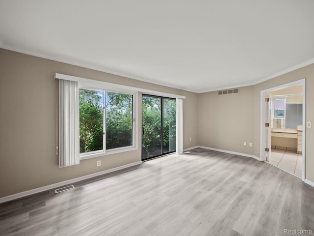 1829 Golf Ridge Dr, Bloomfield Hills, MI 48302 - unfurnished room featuring plenty of natural light, ornamental molding, and light wood-type flooring
