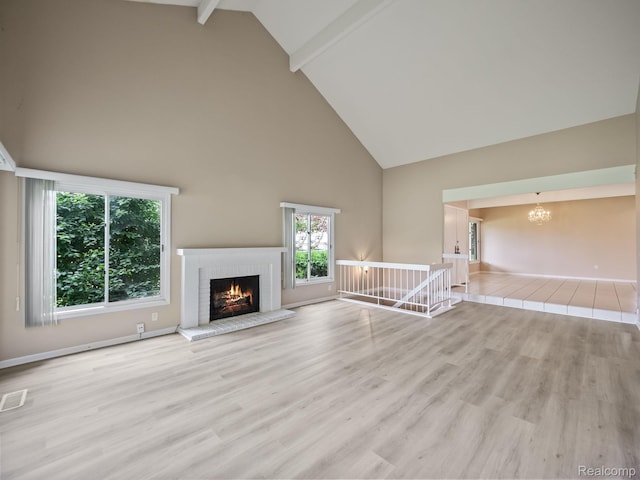 1829 Golf Ridge Dr, Bloomfield Hills, MI 48302 - unfurnished living room featuring high vaulted ceiling, a chandelier, healthy amount of natural light, a brick fireplace, and beam ceiling