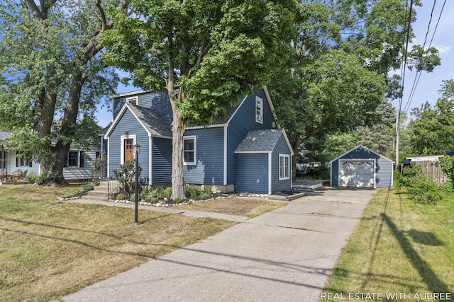 537 Graafschap Rd, Holland, MI 49423 - view of front of house featuring a detached garage, an outdoor structure, a front lawn, and driveway